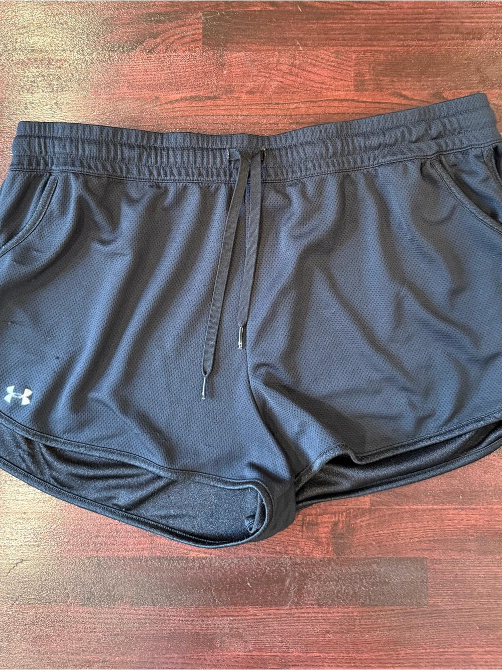 Under Armour black athletic/running shorts in women’s size Large.
